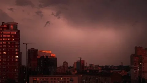 A city under an apocalyptic red storm sky and lightning Video stock 337996017