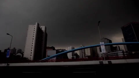 City under dark clouds Stock Footage 235131895