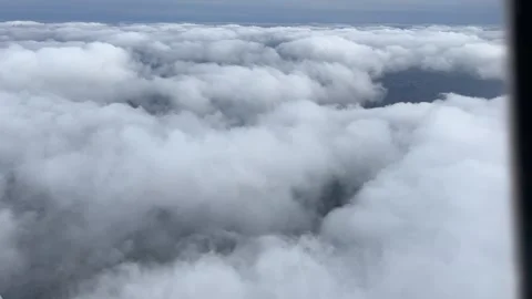 City under a layer of clouds - flying over the clouds Stock Footage 274179789