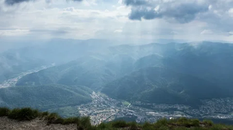 City under the mountain with cloudy sky and fog Stock Footage 39604441