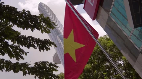 In the city, the Vietnamese flag flutters in the wind Stock Footage 303301448