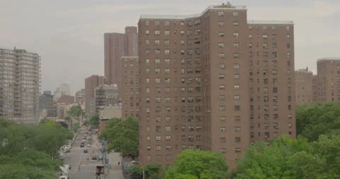 A city view from high angle of a huge brick building and a busy street Stock Footage 150869862