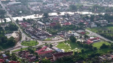 City view with a river running through it. Aerial Bandar Baharu, Kedah Видео 314391543