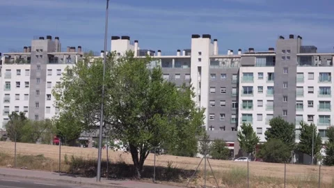 City view shows apartment complexes with trees Stock Footage 336558682