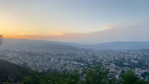 City view at sunset with clouds and natural landscape of Tbilisi, Georgia Stock Footage 277272136
