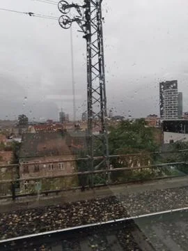 City view from a train, capturing the Skypark building Photos