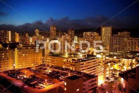 City View Of Waikiki, Oahu, Hawaii At Night Stock Illustration