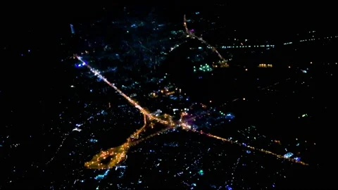 The city is visible at night from Airplane window, view from the outside, the Stock Footage 235280737