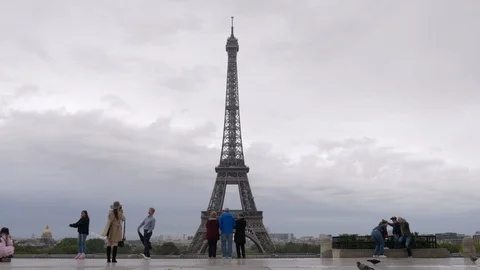 City visitors at viewing point taking shots with Eiffel Tower, Paris Stock Footage 89885014