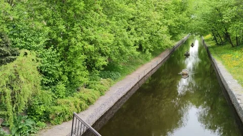 City water canal. Trees are reflected on the water of a calm river Stockbeeldmateriaal 198048053