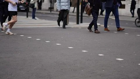 City workers walking to work on a weekday morning Stock Photos