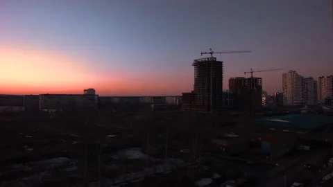 Cityscape against the backdrop of the setting sun Stock Footage 142060682