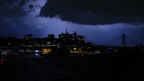 Cityscape and Lightning  storm over Sydney night traffic 4K Stock Footage 168522816
