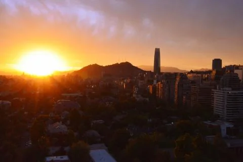 Cityscape and sunset clouds Stock Photos