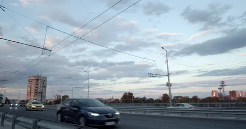 Cityscape boulevard traffic at sunset with skyline - time-lapse Stock Footage 202884997