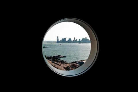 A cityscape from a circular window Stock Photos