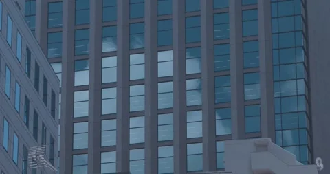 A cityscape of cloud reflecting the building at the business town Stock Footage 342508564