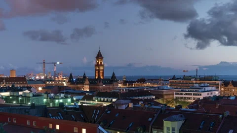 Cityscape at Dusk with Clock Tower and Construction Stock Footage 304174925