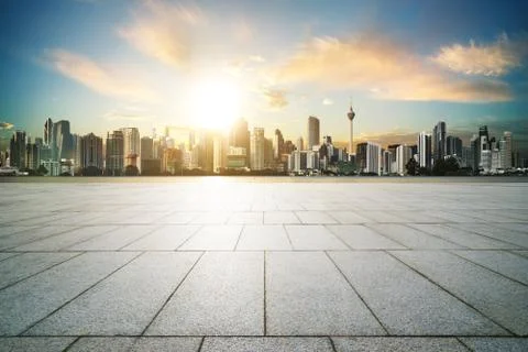 Cityscape with empty brick floor ,sunset sunrise scene . Stock Photos