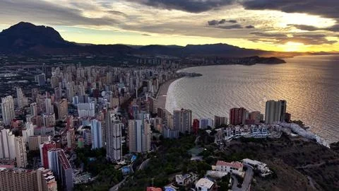 Cityscape evaluating bay and mountain, aerial view showing urban layout along Stock Photos