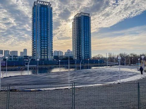 A cityscape features modern architectural structures with solar panels, sugge Stock Photos