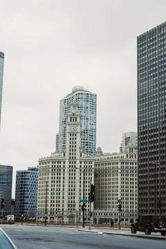 Cityscape featuring historical clock tower alongside modern buildings in Ch.. Stock Photos