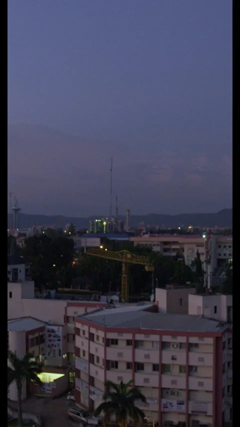 Cityscape Glows Rooftop View Elevated - Vertical (9:16) Stock Footage 322549148
