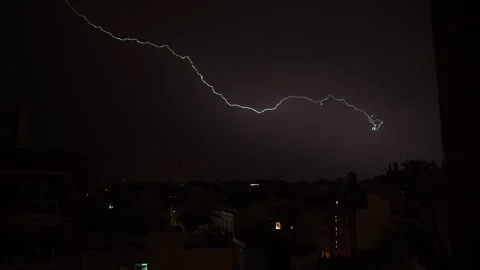 Cityscape Lightning Storm , a single bolt of lightning strikes across a dark sky Stock Footage 277218048