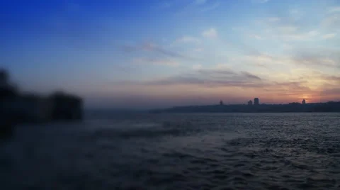 Cityscape near sea over blue sky. Stock Footage