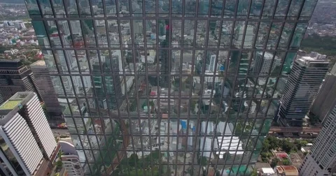 Cityscape Reflection In Windows Of Modern Office Block In Central Bangkok, Video stock 80245960