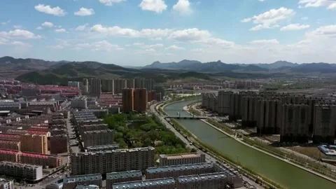 Cityscape with river and distant mountains. Stock Footage 336335671