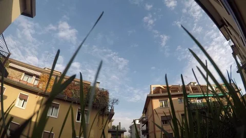 Cityscape as seen from behind a ground timelapse 4k Stock Footage 73545104