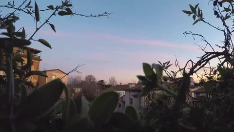 Cityscape as seen from behind a window day to night timelapse 4k Stock Footage 73544889