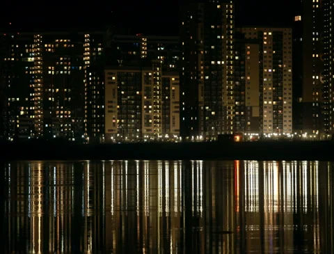 Cityscape skyscraper reflected in water night zoom out Stock Footage 151853713