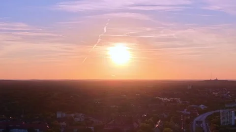 Cityscape at Solar Eclipse golden hour, setting sun. Nice aerial view drone Stock Footage 344600839