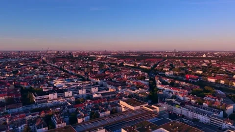Cityscape at Solar Eclipse golden hour, setting sun. Magic aerial view drone Stock Footage 344614295