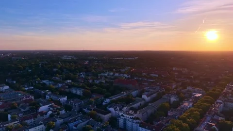 Cityscape at Solar Eclipse golden hour, setting sun. Best aerial view drone Stock Footage 344614506