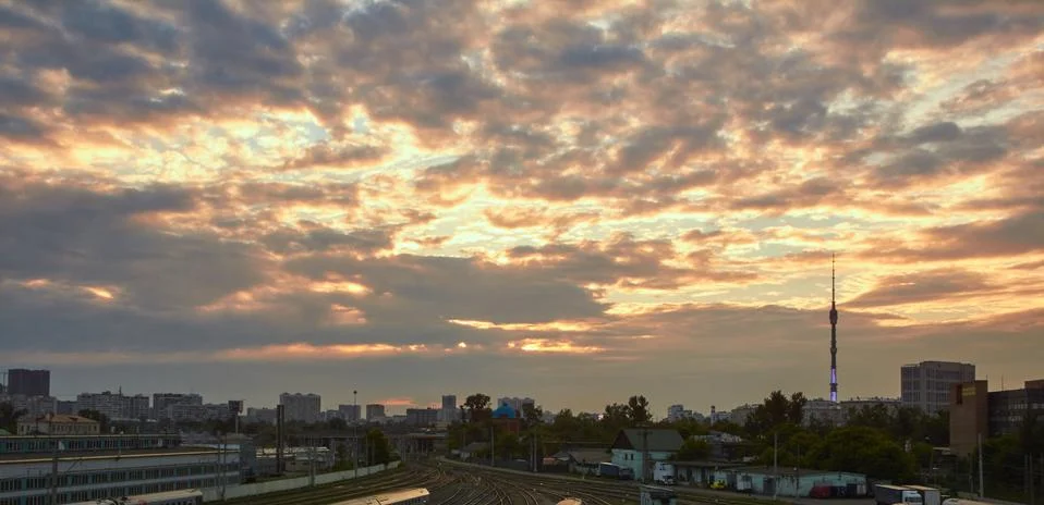 Cityscape at sunset with the clouds at background Stock Photos