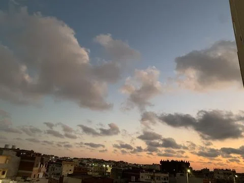 Cityscape at Sunset with Dramatic Sky 写真素材