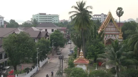 Cityscape with temple and palm trees in Vientiane, Laos, Asia Stock Footage
