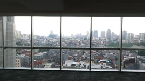 Cityscape through glass wall, camera approach and look out, dusk aerial panorama Stock Footage 51754752