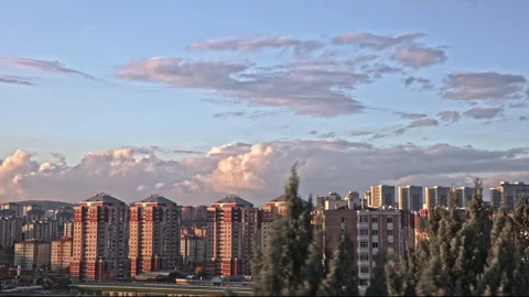 Cityscape Time Lapse at Dusk – High-Rise Buildings and Cloud Movement in 4K Stock Footage 321089342