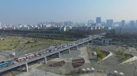 Cityscape with transport traffic on flyover of Olympic freeway Stock Footage