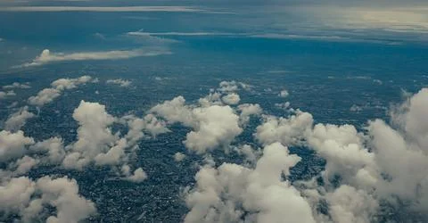 Cityscape under clouds Stock Photos