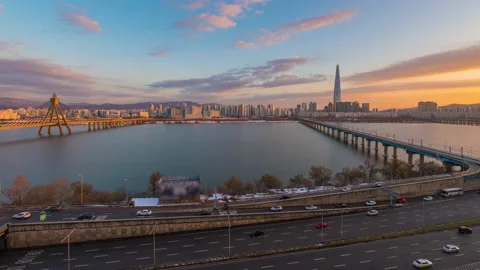 Cityscape view during dusk overlooking river with traffic Stock Footage 167491650