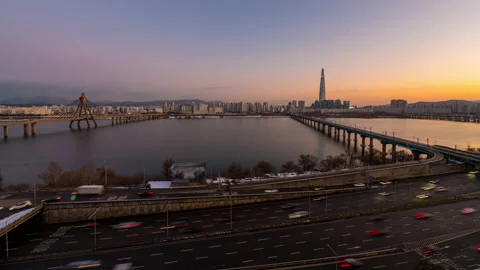 Cityscape view during dusk overlooking river with traffic Stock Footage 167491678