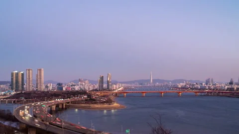 Cityscape view during dusk overlooking river with traffic Stock Footage 167491692