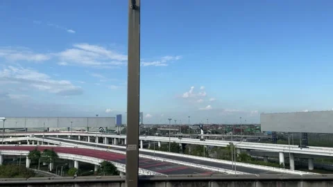 Cityscape view on moving train, empty billboard, blue sky, vehicles moving Stock Footage 183539598