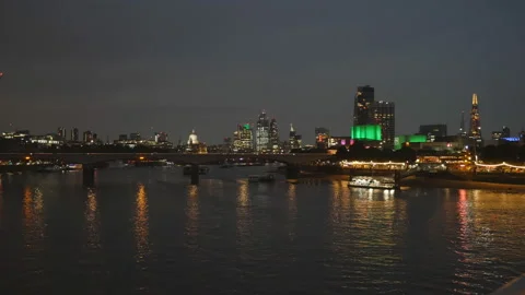 A cityscape view by a river at night. Stock Footage 129878649