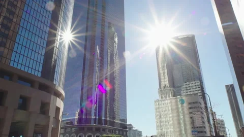 Cityscape view with sun flare central Los Angeles. Shot of reflective windows Stock Footage 170196464